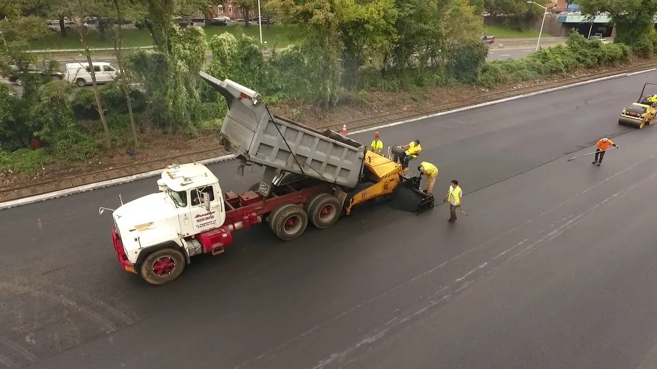 Commercial asphalt paving contractor at work in College Point Queens — base preparation and compaction