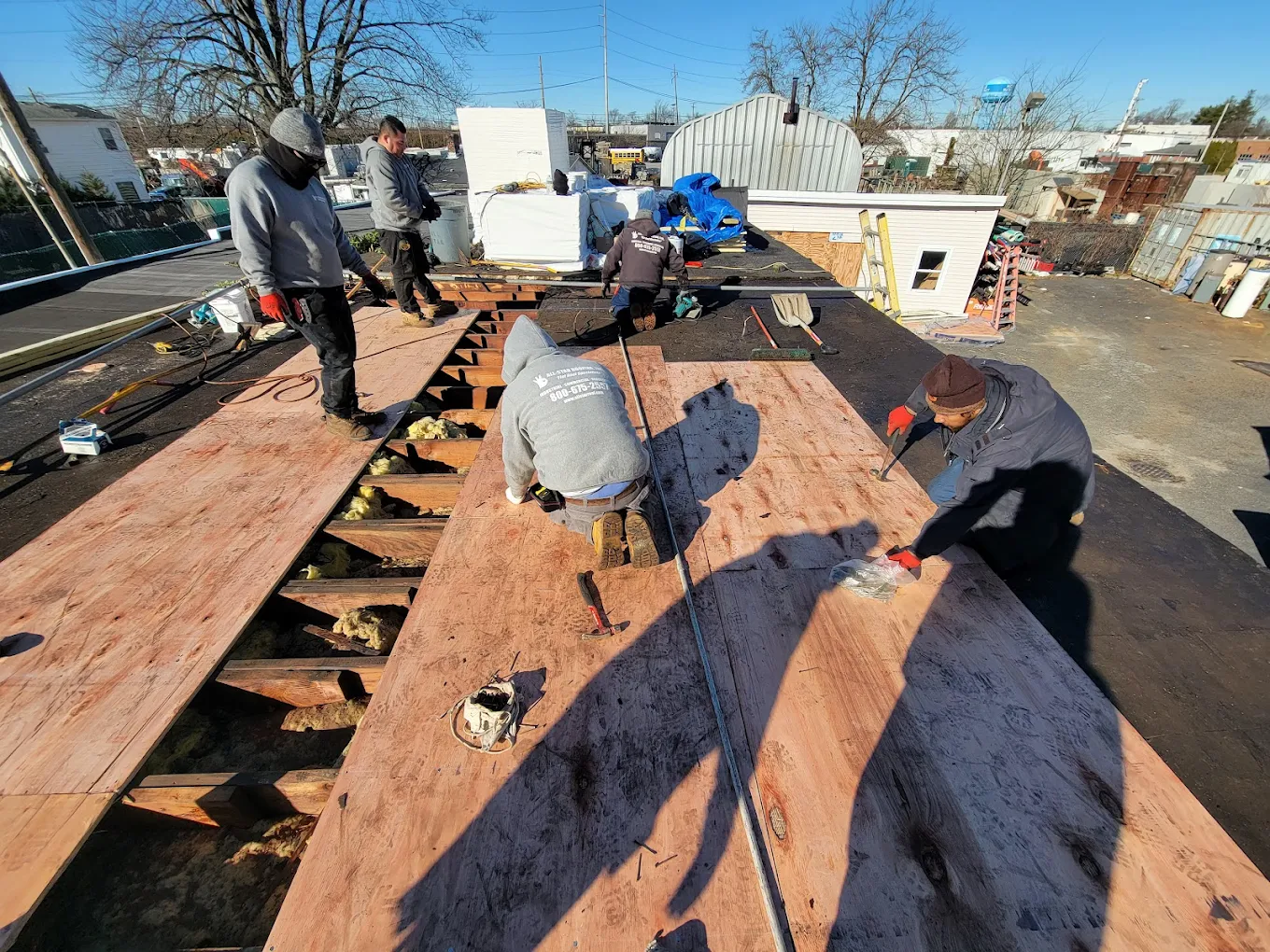 EPDM flat roof installation near Lindenhurst NY — South Shore commercial building project by All-Star Roofing Inc.