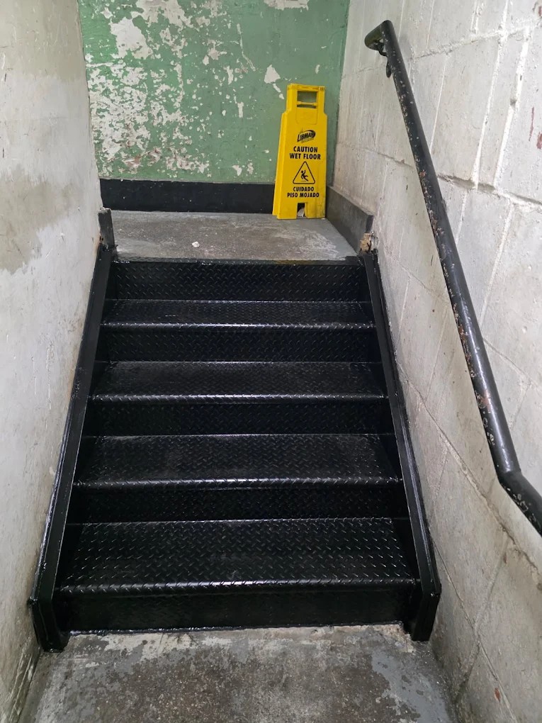 Steel fabricator in Brooklyn NY — sidewalk cellar door installation process on residential brownstone