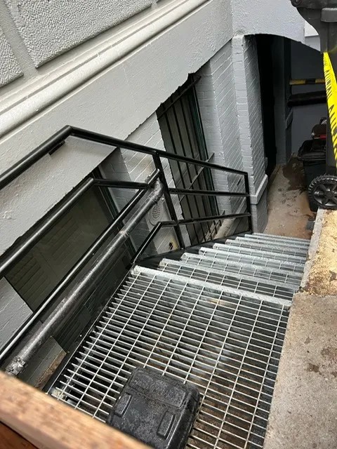 Completed steel guard railing installation in Brooklyn NY — custom pipe railing on commercial building rooftop